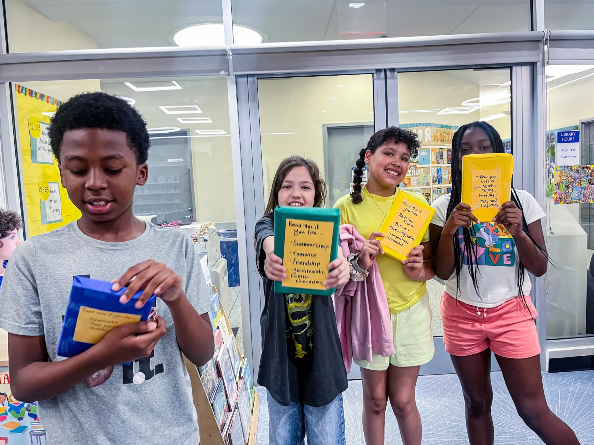 students smiling in the library