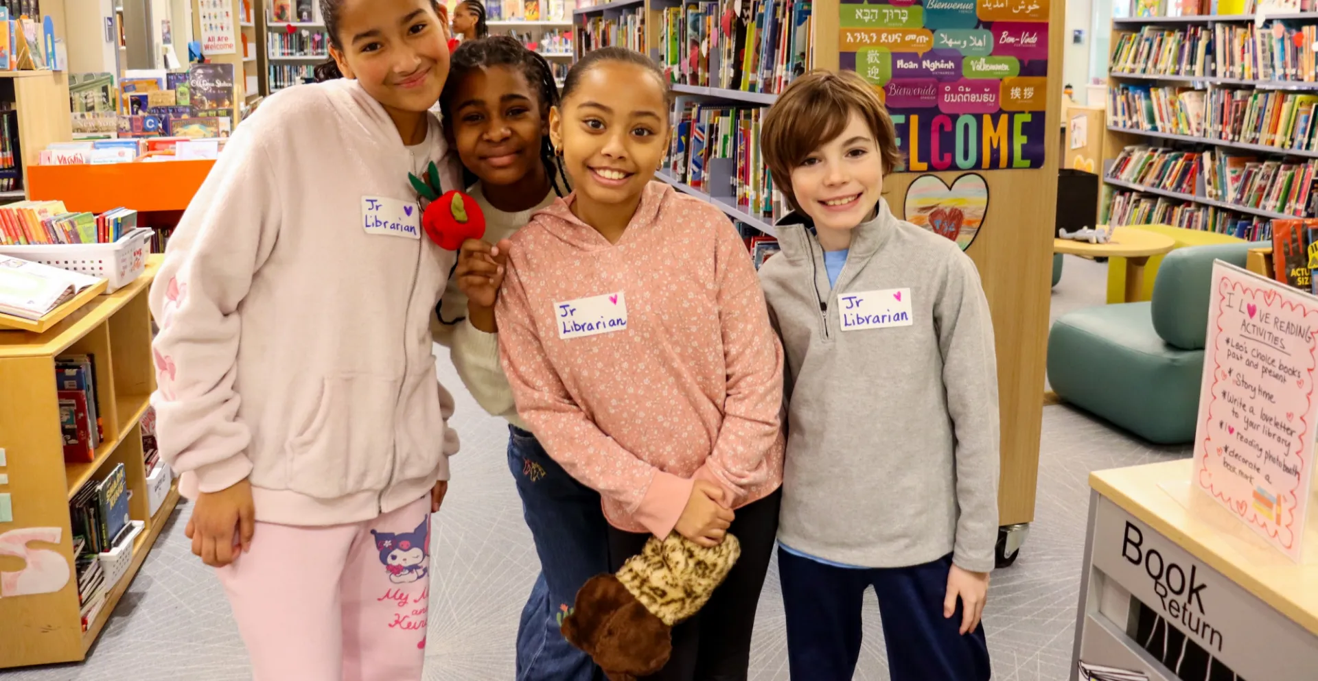 students smiling in the library