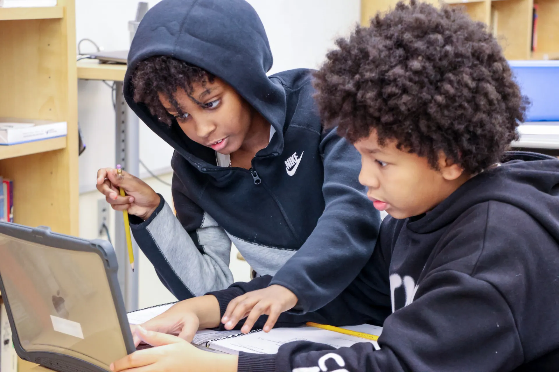 students working together on laptop